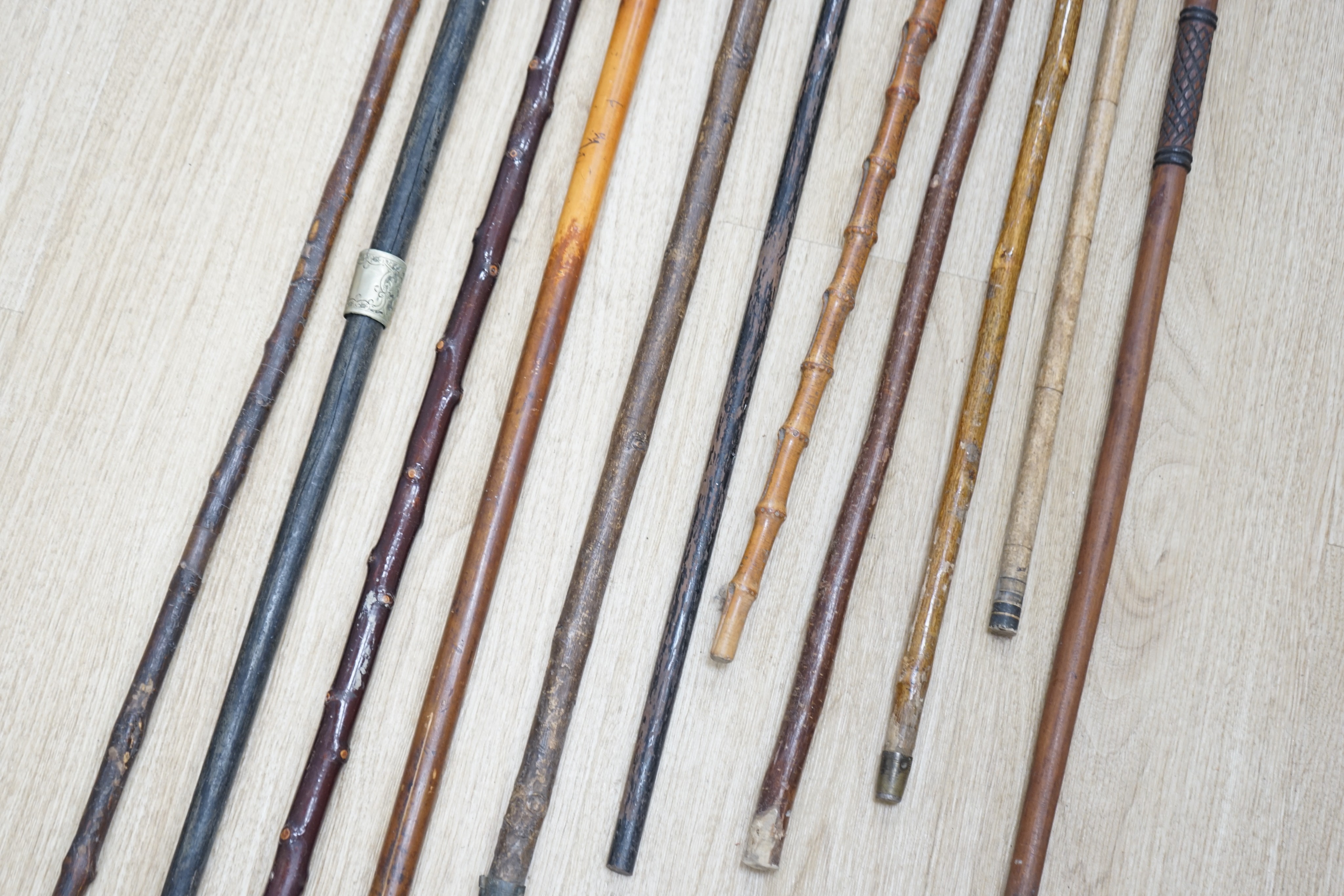Twelve assorted walking sticks including silver mounted and staghorn handled